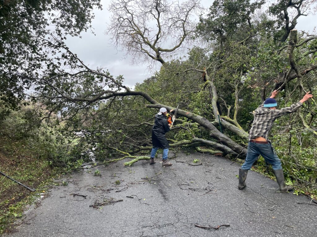 residents clearing the debris